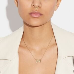 NWT Coach gold pave bow pendant necklaces
